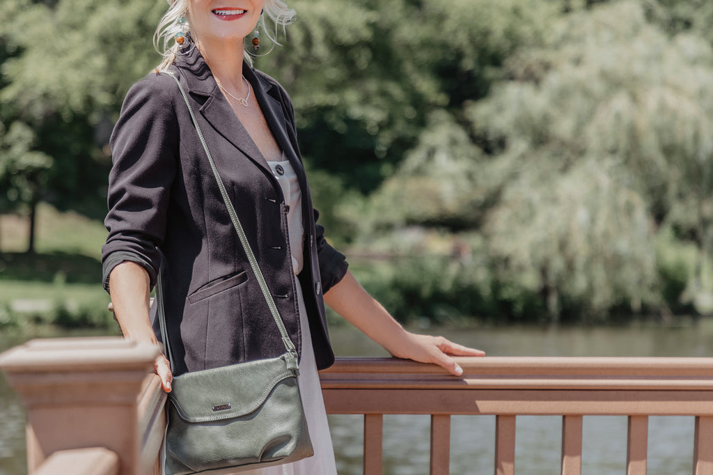 The Dos and Don’ts of Fall Fashion - Koltov Handbags - Pictured is our Ruby Crossbody Bag being held by a woman in a black jacket.  